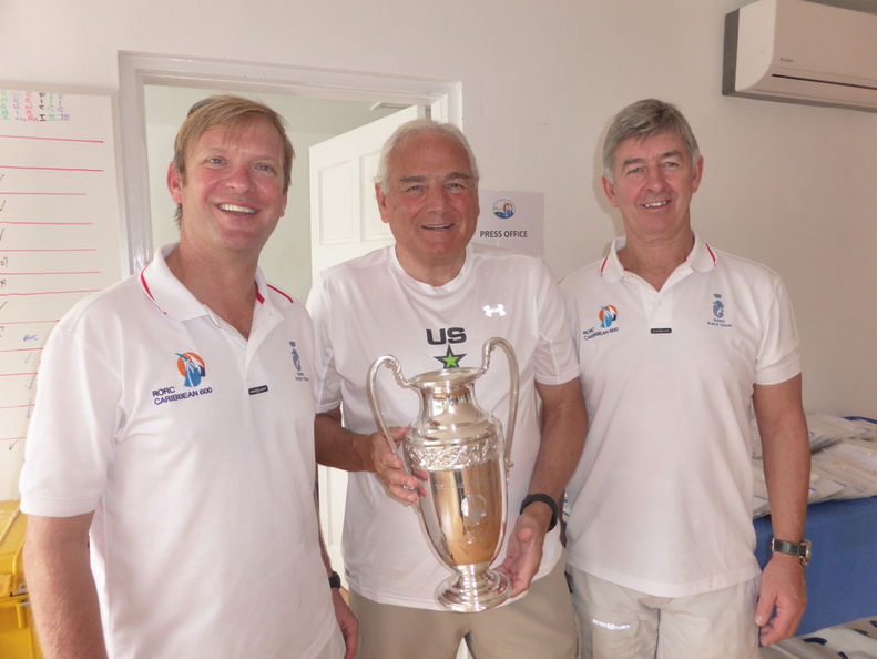 Hap Fauth presents the new Bella Mente trophy to Nick Elliott and Eddie Warden Owen of the RORC