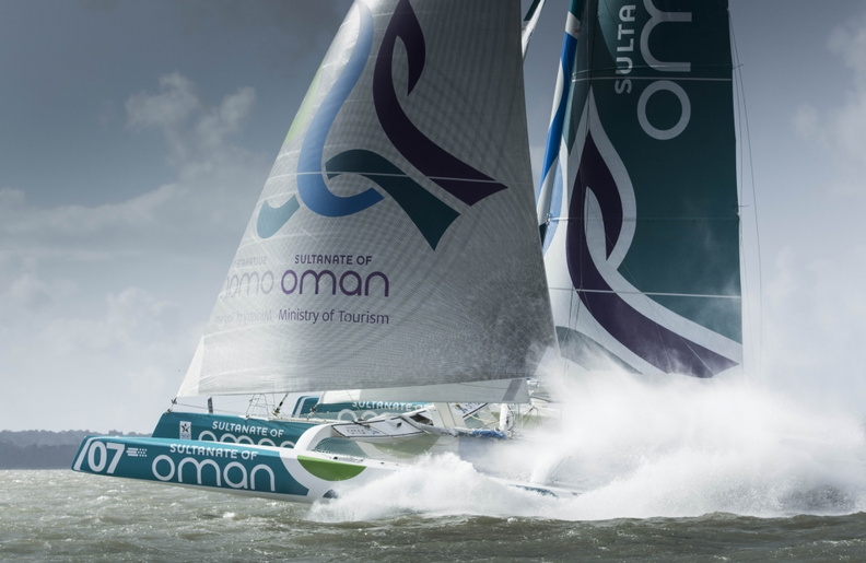 Taking flight, the powerful trimaran heads to the finish line in style.