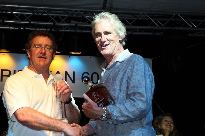 Mike Slade accepts his rum from Mike Greville