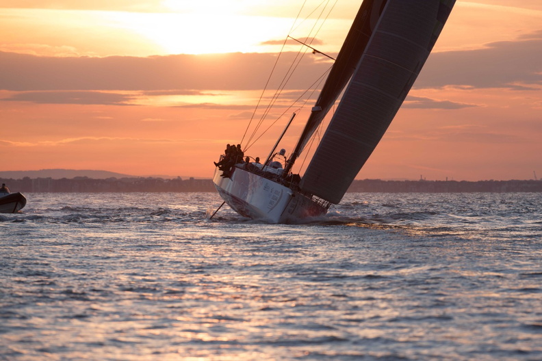 Sam Davies guides the Volvo Ocean 65 back to cross the finish line