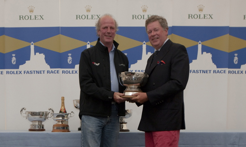 Rolex Fastnet Race Prizegiving at The Royal Citadel Barracks in Plymouth. ICAP LEOPARD crew member with RORC Commodore