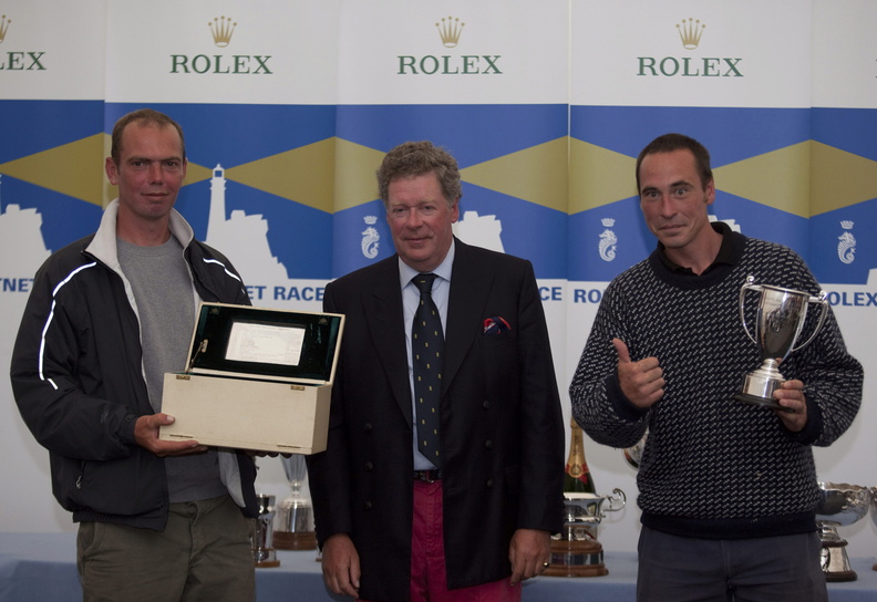 Rolex Fastnet Race Prizegiving at The Royal Citadel Barracks in Plymouth. RORC Commodore Andrew McIrvine with unknow person
