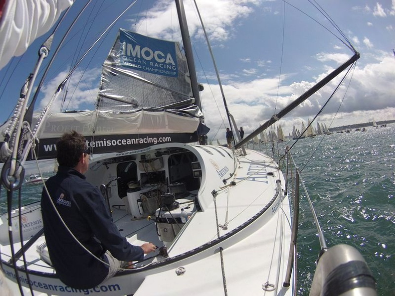Brian Thompson steers IMOCA 60 Artemis into a busy starting area. Photo-RORC. Photo:Full Copyright