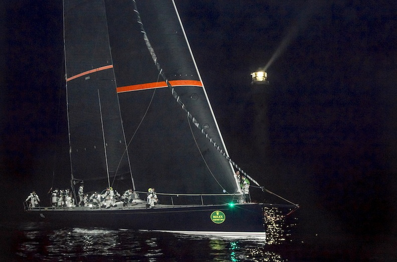 Darkness of the night for Bella Mente at the Fastnet Rock. Photo:ROLEX/Daniel Forster. Photo:Full Copyright.