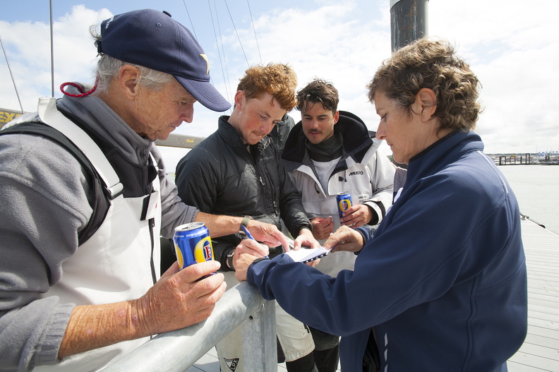 Varuna crew sign their declaration at the end of the race