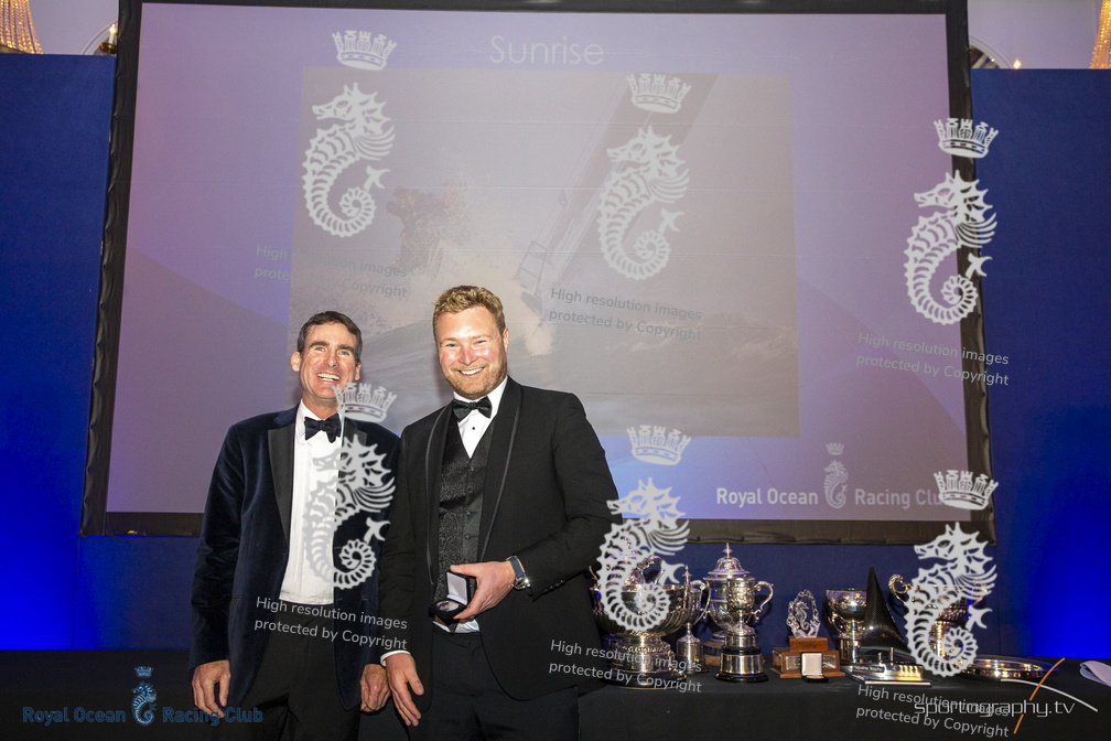 Deputy Racing Manager Tim Thubron presents Tom Kneen with prizes for 2nd in IRC Two and 3rd in IRC Overall for Sunrise