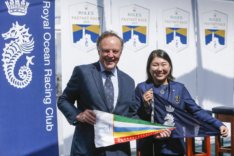 RORC Commodore Michael Boyd exchanges burgees with Ting Lee, owner of the all-Chinese entry and club, Noahs Sailing Club