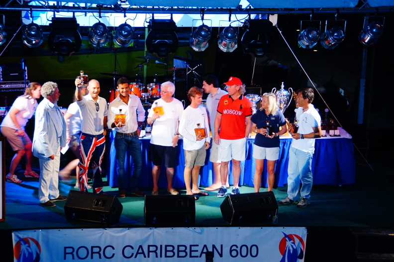Competitors collect their rum bottles