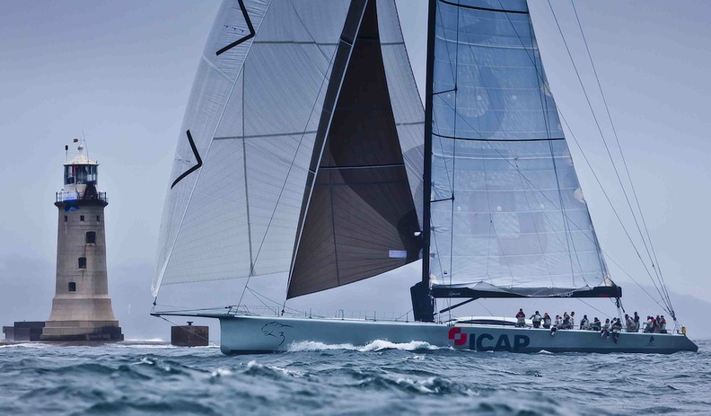 Previous monohull record holder  Mike Slade s ICAP Leopard passes The Fastnet Rock Credit Rolex Carlo Borlenghi