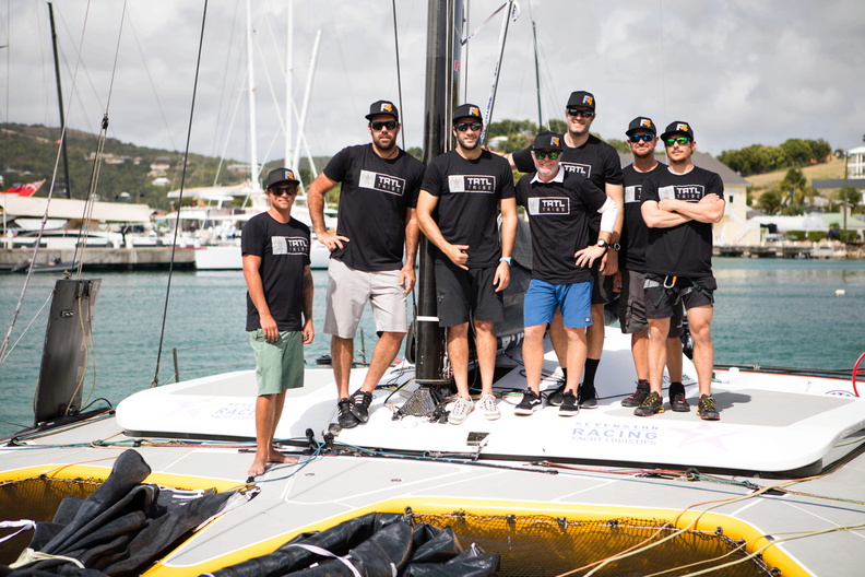 The crew of multihull Falcon assemble on deck