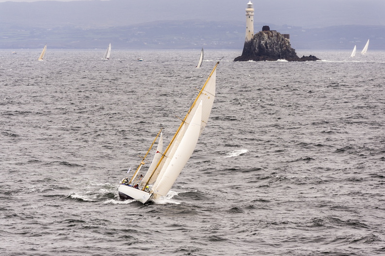 Dorade, competing in the class IRC 3 rounds the Fastnet Rock