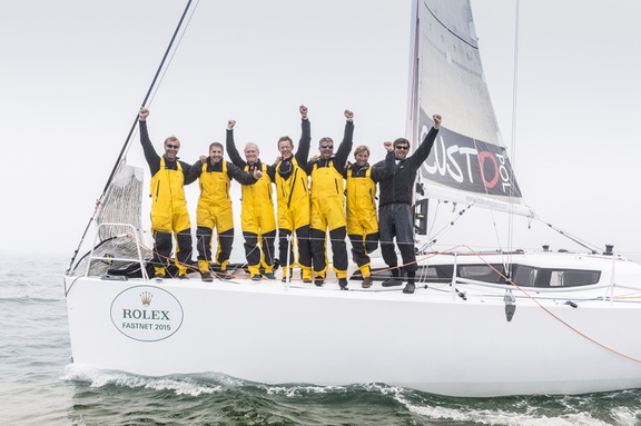 The Courrier Du Leon crew celebrates as they cross the finish line