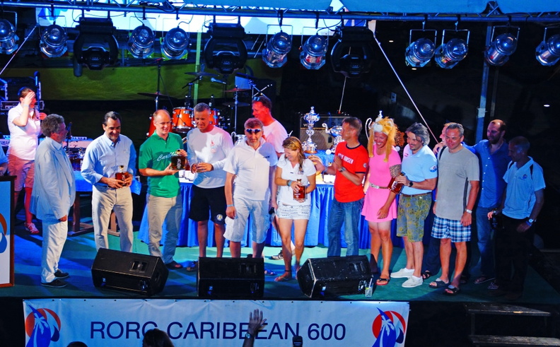 Competitors collect their rum bottles