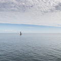 A solitary competing boat heading towards the Fastnet Rock