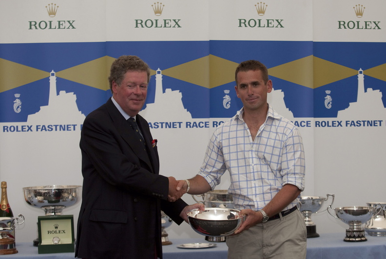 Rolex Fastnet Race Prizegiving at The Royal Citadel Barracks in Plymouth. RORC Commodore Andrew McIrvine with Luke McCarthy