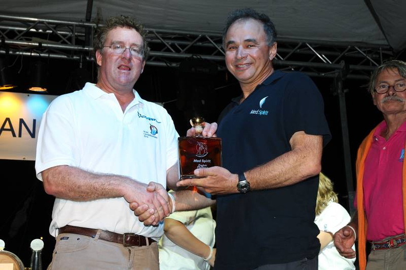 Mike Greville awards a prize to Didier Lacombe, skipper of Med Spirit