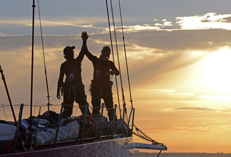 High fives onboard as Team SCA celebrate their finish and record