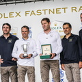 Co-skippers Charles Caudrelier and Franck Cammas pose with their prizes