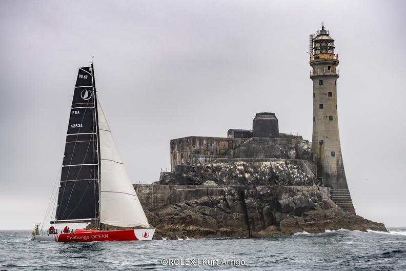 Libertalia, VO60 sailed by Valdo Dhoyer, passes the Fastnet Rock