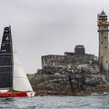 Libertalia, VO60 sailed by Valdo Dhoyer, passes the Fastnet Rock