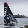 Charal, the IMOCA skippered by Jeremie Beyou and Christopher Pratt cruises in to Cherbourg
