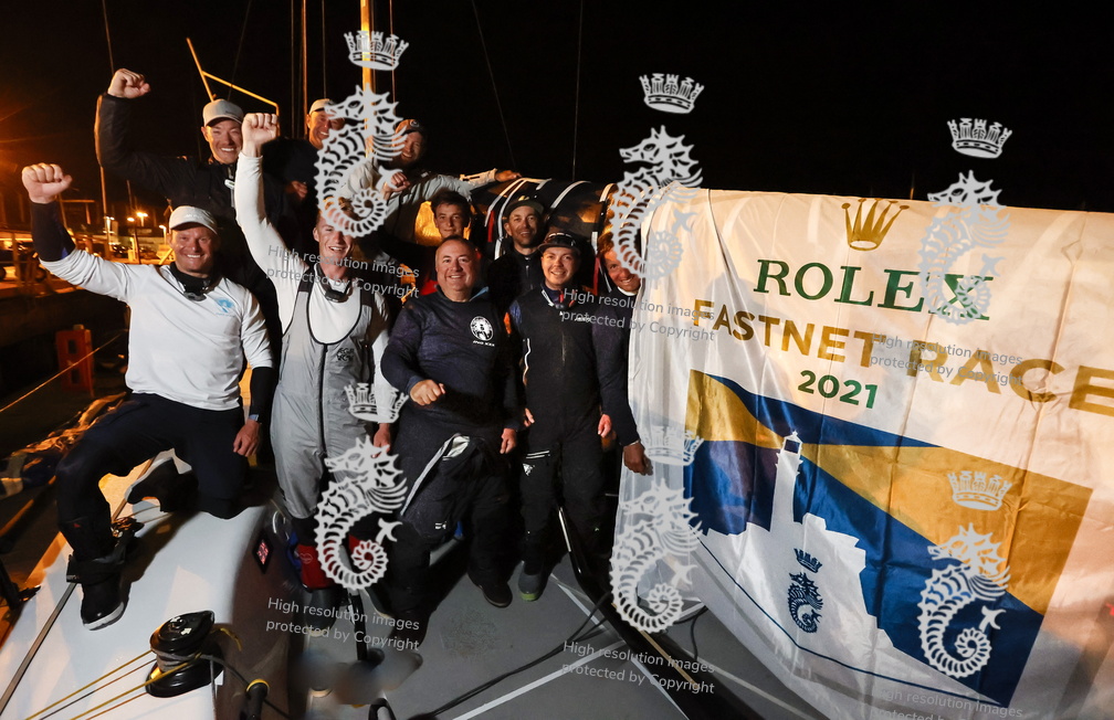 RORC Commodore James Neville and his crew of INO XXX celebrate finishing the Rolex Fastnet Race