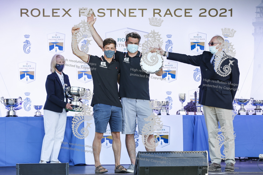 Alexis Loison and co-skipper Guillaume Pirouelle collect the Brunskill Trophy for Best Two-Handed Yacht Overall, presented in person by David Brunskill, they also won the Favona Cup for 1st in IRC Three, 