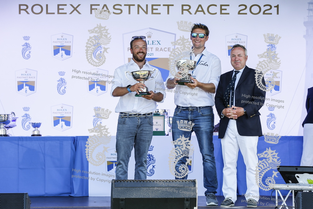Tala representatives collect the Hong Kong Trophy for 1st in IRC Zero and the Clarion Cup for first British yacht home, ie across the line in Cherbourg