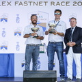 Tala representatives collect the Hong Kong Trophy for 1st in IRC Zero and the Clarion Cup for first British yacht home, ie across the line in Cherbourg