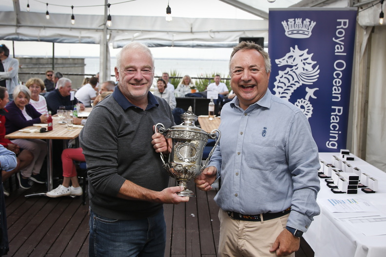 Castle Rock Race winner - Tala’s David Collins presented with the Loujaine Trophy by RORC Commodore James Neville