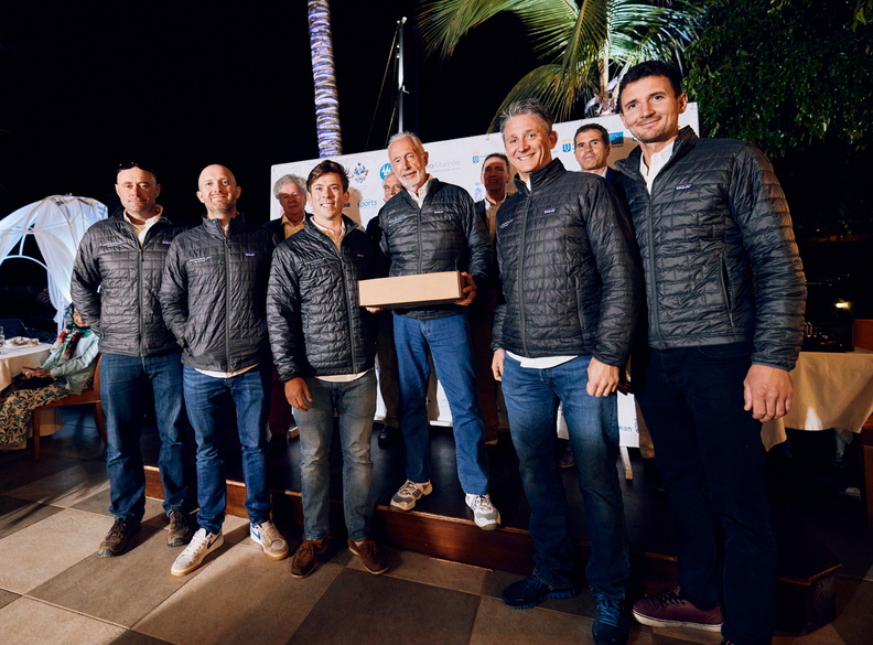 Peter Cunningham and his crew of MOD 70 Powerplay collect their keepsake