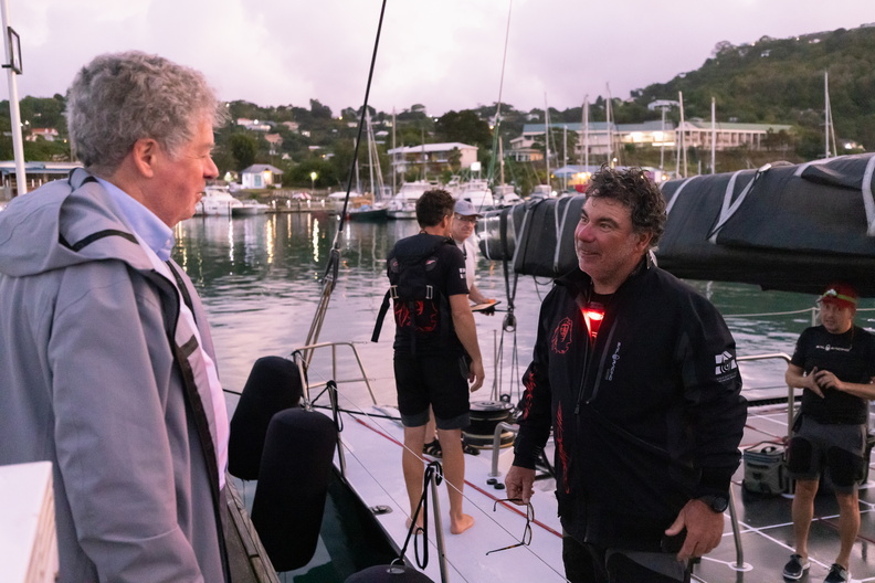 Comanche's skipper Mitch Booth is welcomed by Andrew McIrvine, Secretary General of the IMA
