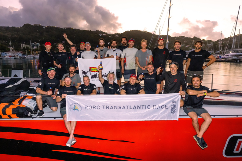 Comanche pose with the official race banner