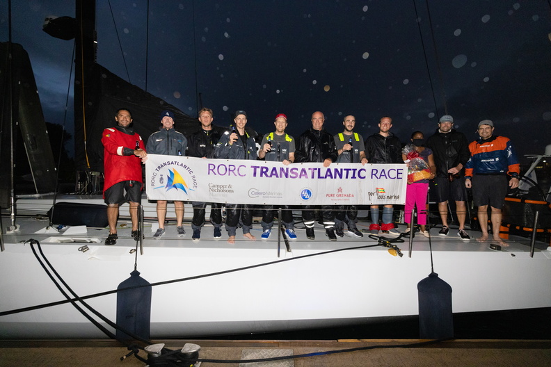 Volvo 70 L4 Trifork crew gather on deck for the banner photo