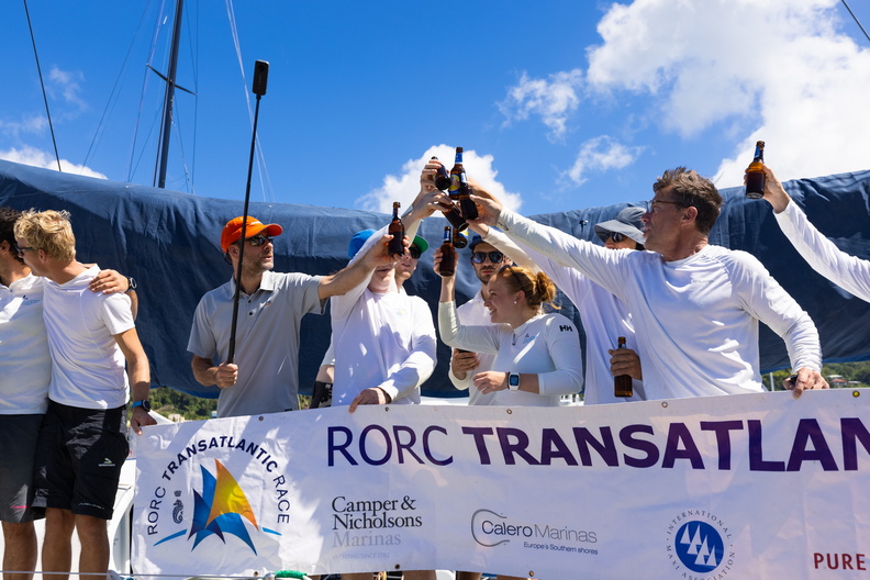 Sisi's Austrian Ocean Race Project crew gather with the official race banner 