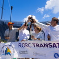 Sisi's Austrian Ocean Race Project crew gather with the official race banner 