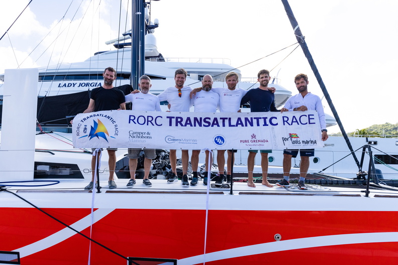 Crew of Club 5 Oceans celebrate at the finish in Grenada