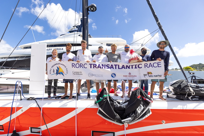 Crew of Club 5 Oceans celebrate at the finish in Grenada