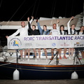 Diana's crew pose with the official race banner