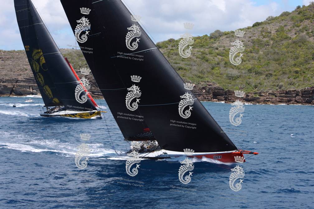 100ft Comanche, skippered by Mitch Booth, takes the lead over Dmitry Rybolovlev's 125ft Skorpios