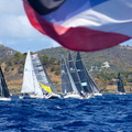 Yachts gather in the starting area under the Antiguan flag