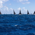 The fleet proceed down the Antiguan coast
