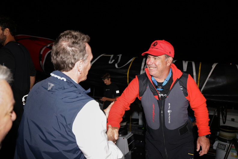 RORC CEO Jeremy Wilton greets Mitch Booth at the end of the race