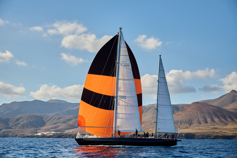 Pen Duick VI passes Lanzarote after the start of the race