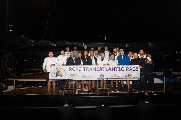 The crew of the largest yacht in the fleet, 115ft Swan Jasi, celebrate their race