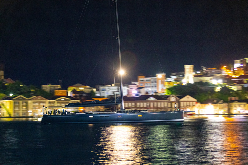Jasi arrives under the dark skies and bright lights of Grenada's Port Louis