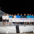 The crew of the Botin 56 Black Pearl celebrate at the finish of the race