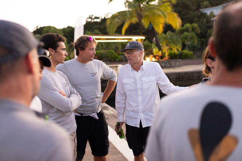 Members of Teasing Machine's crew talk to Rafale's owner Henri de Bokay