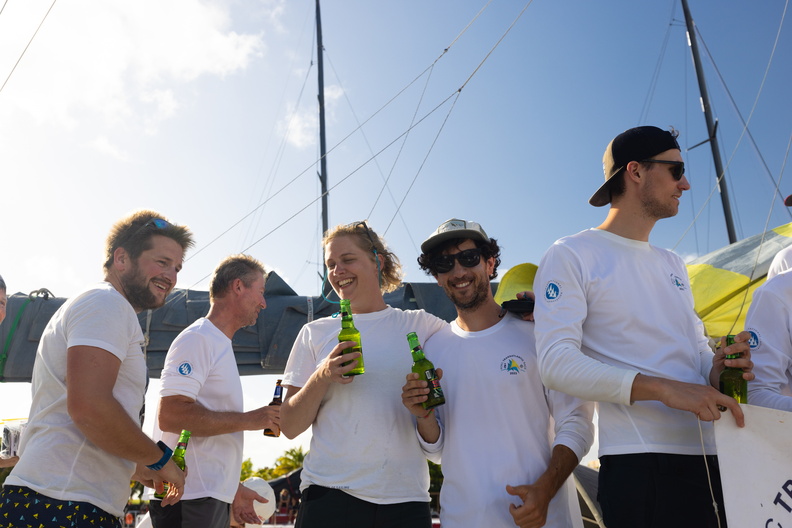 Green Dragon's crew celebrate finishing the race