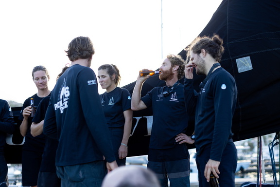 Pen Duick VI's crew celebrate on board at the end of the race
